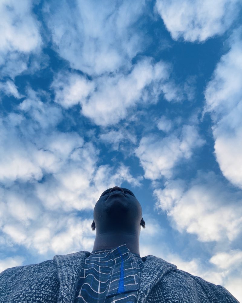 Looking up at a sky full of broken cloud